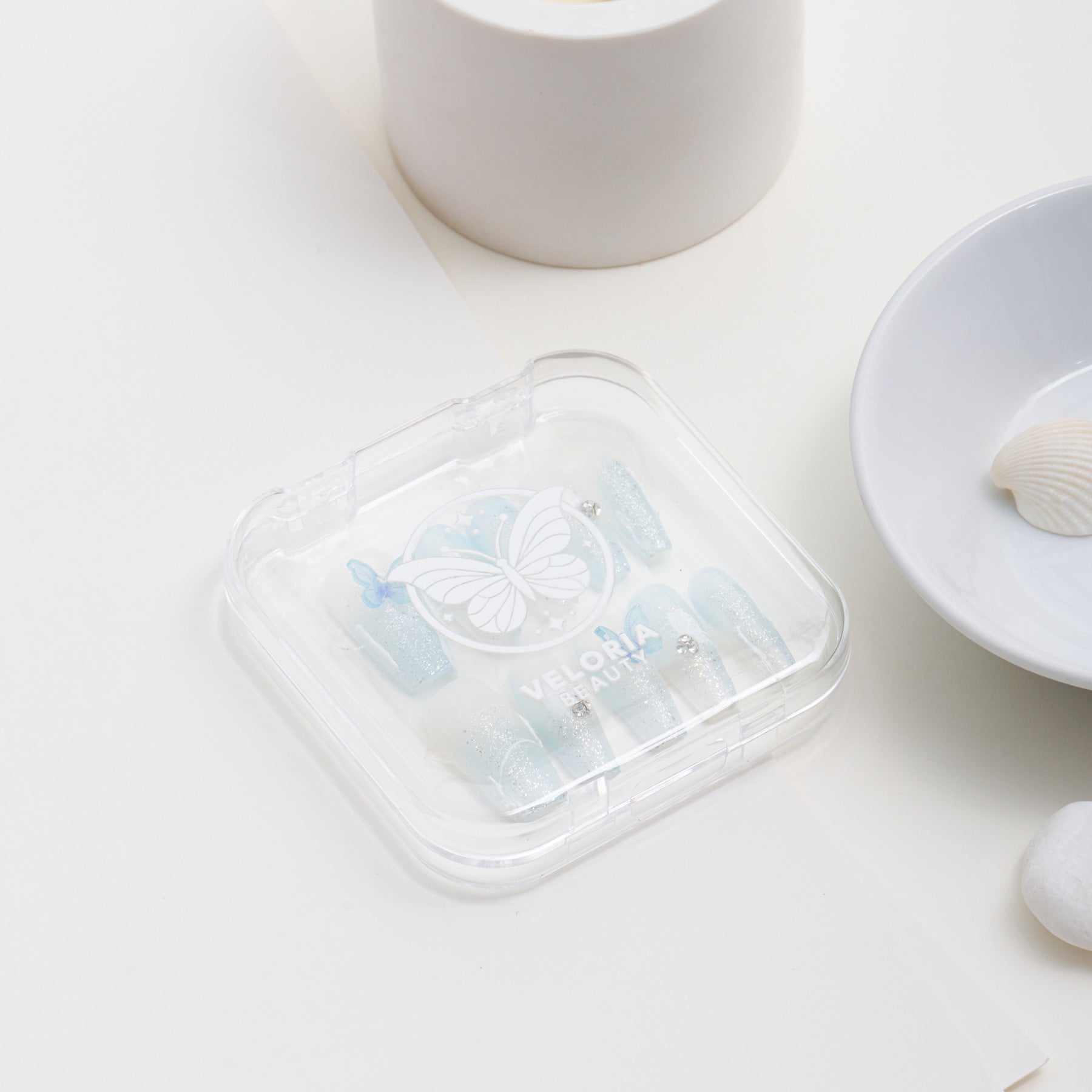 Azure Butterfly Elegance Handmade Press On Nails - Coffin-shaped Blue butterfly press on nails featuring sparkling blue hues, glistening rhinestones, and delicate butterfly accents