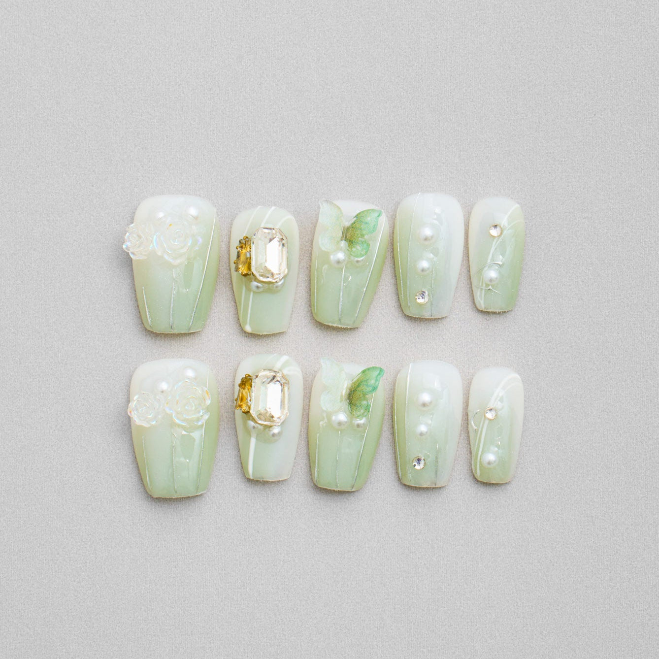 Veloria Beauty "Botanical Butterfly Bash" Coffin Shaped Handmade Press On Nails - Green butterfly press on nails featuring a soft green color, butterflies and blooming rose accents for a floral-inspired look