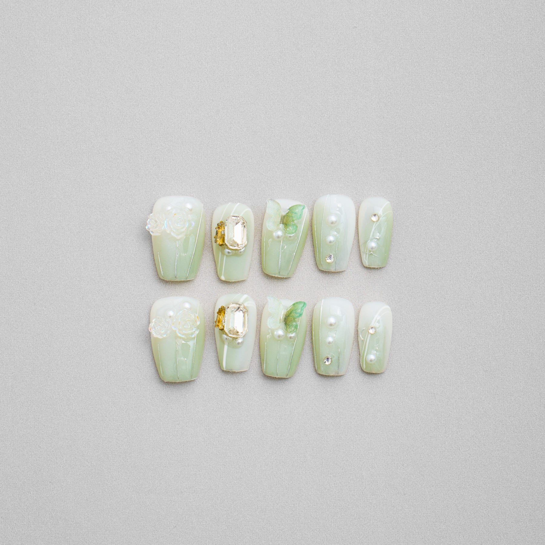 Veloria Beauty "Botanical Butterfly Bash" Coffin Shaped Handmade Press On Nails -  Green butterfly press on nails featuring a soft green color, butterflies and blooming rose accents for a floral-inspired look