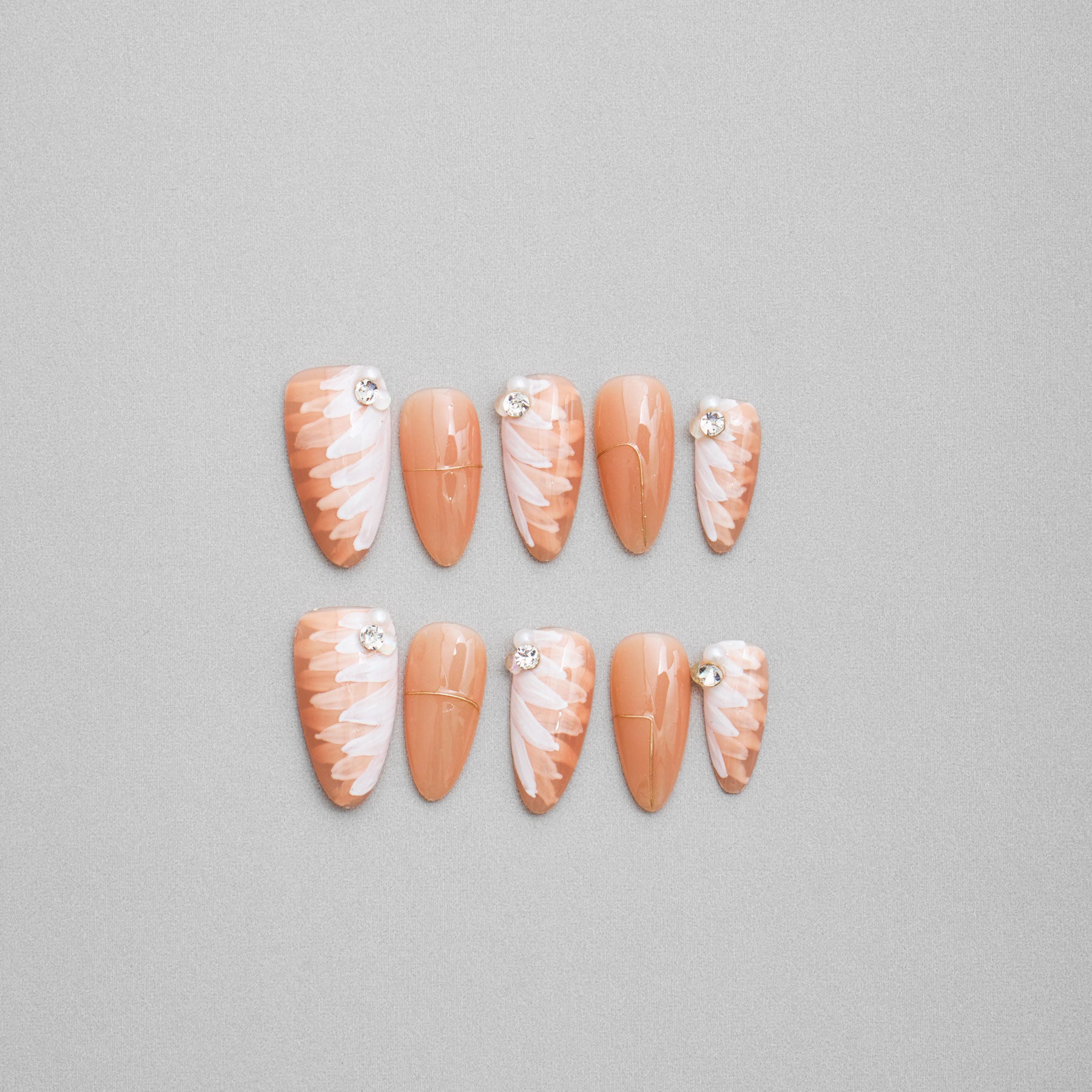 Veloria Beauty "Champagne Flowers" Almond Shaped Handmade Press On Nails - Featuring a refined champagne hue with dazzling diamond studs and delicate floral accents, perfect for an elegant bridal look